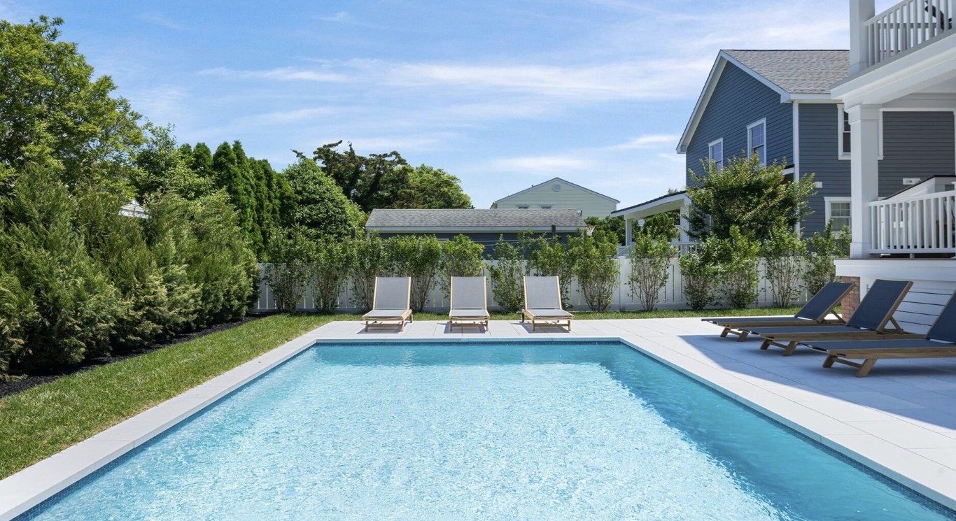 Well-maintained residential backyard pool in The Hammocks neighborhood